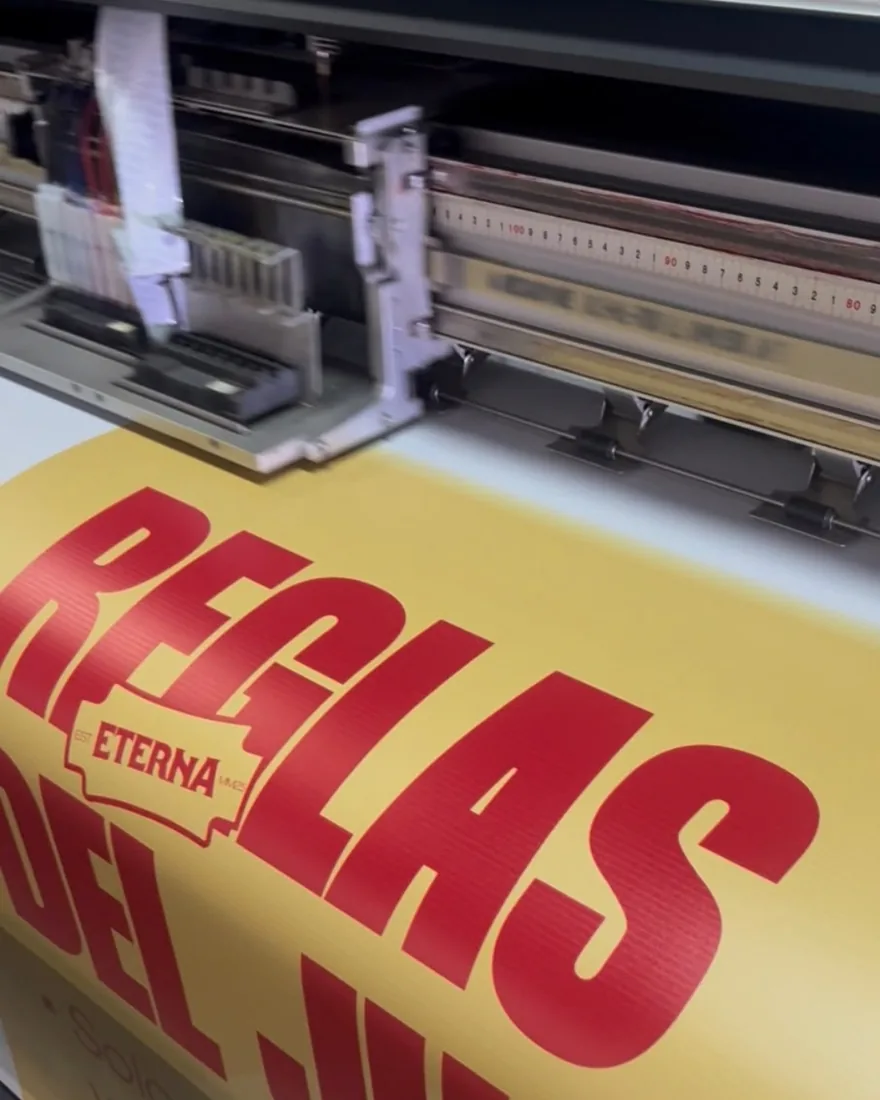 Large-format printer printing an advertising sign